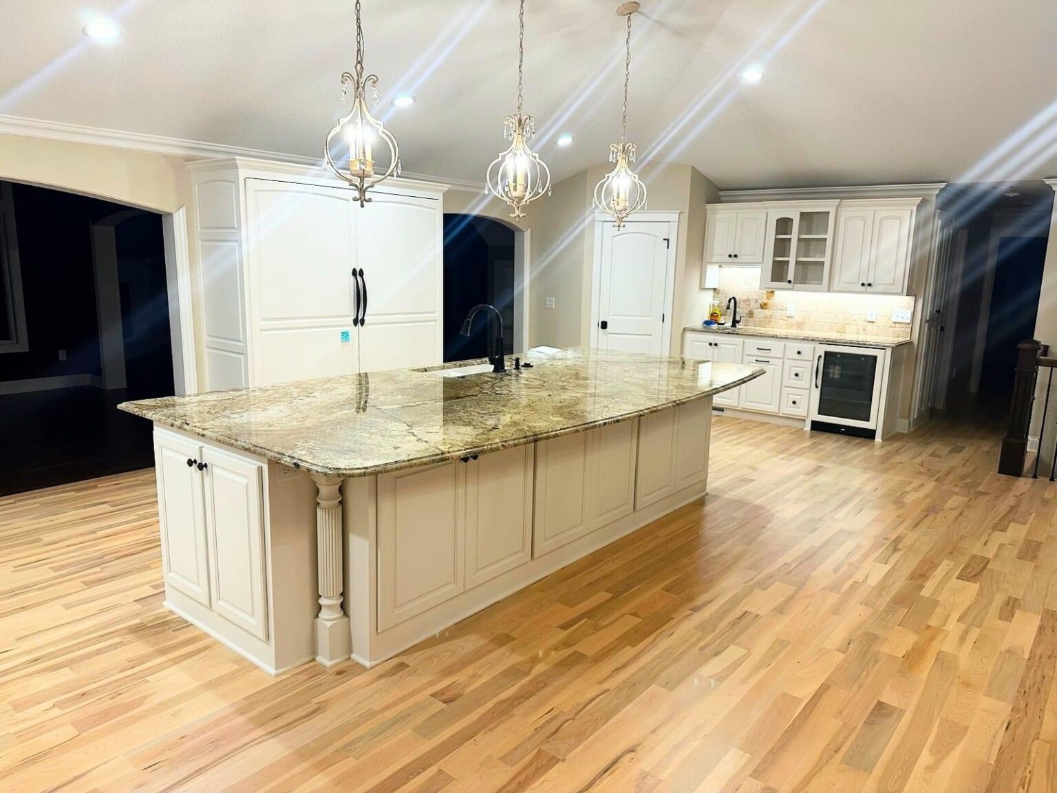 Large kitchen island with granite countertop