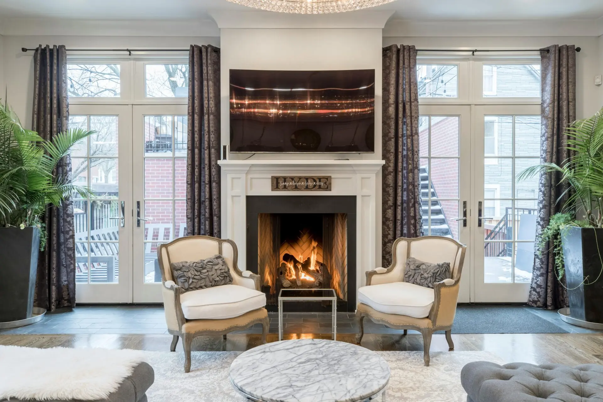 Stylish and contemporary living room featuring a cozy fireplace and elegant furniture.